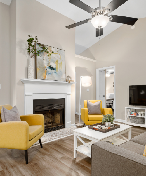 A living room filled with furniture and a fire place