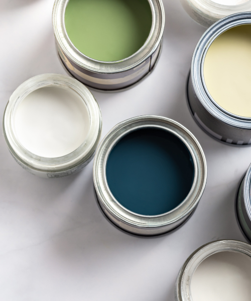 A group of paint cans sitting on top of a table