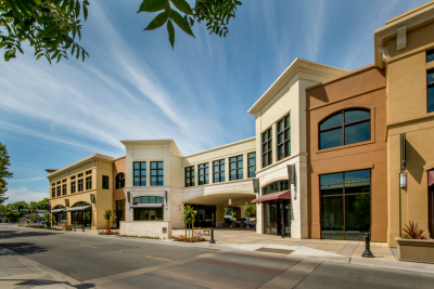 A row of buildings sitting on the side of a road